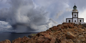 Santorini-(Thira),-Cyclades,-Greece,-cityscape,-clouds,-rain,-clouds,-lighthouse,-2x1